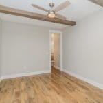 Open living space with wood beam and natural light
