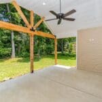 Covered patio with wood beams and ceiling fan